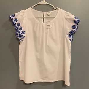 J. Crew white blouse with blue sleeve detailing. Size M.